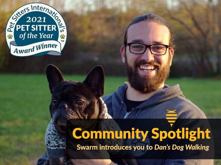 Picture of Daniel Reitman holding a dog with award logo