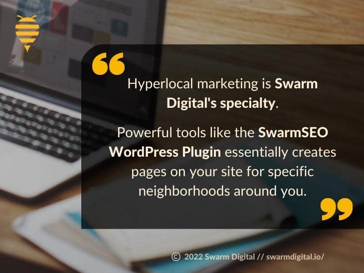 Callout 4: Designer's laptop and design paperwork on desk - Swarm Digital's specialty is SwarmSEO WordPress plugin