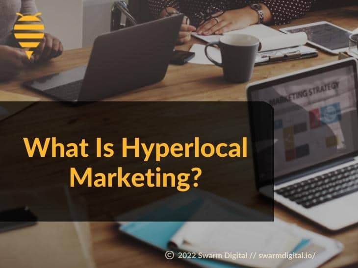 Featured: Digital marketing team brainstorming at desk- What Is Hyperlocal Marketing?