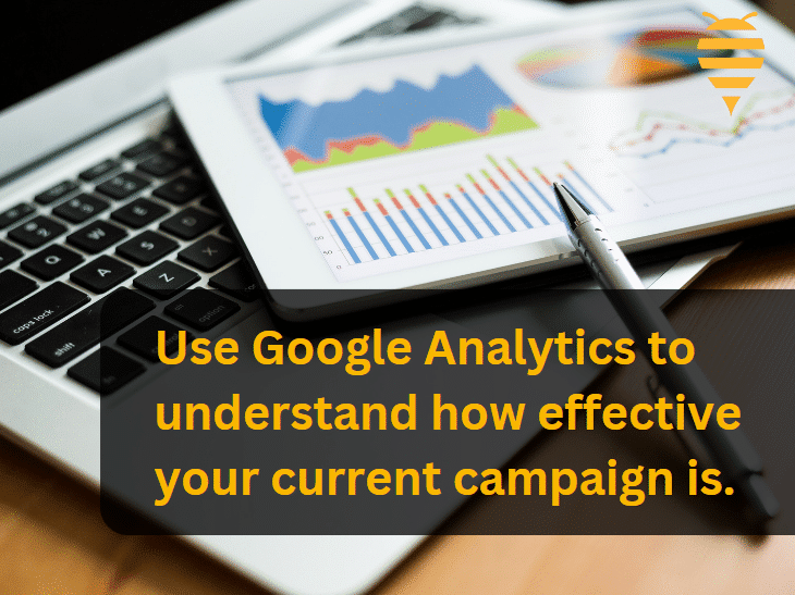 this graphic features an ipad with Google Analytic metrics measured in stacked barcharts of colours blue, red, and green. There is overlay text highlighting the importance of analytics - analytics help you understand the effectiveness of your current campaign.