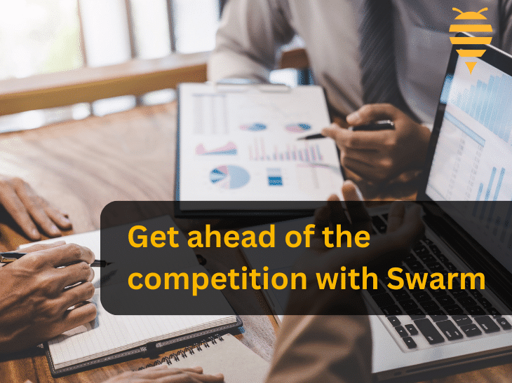 This graphic features a meeting between a marketing executive and a client, who are tailoring an effective campaign. They are taking notes, looking at relevant metrics on a laptop and ipad. There is overlay text highlighting that you can get ahead of the competition with Swarm digital marketing. in the top right is the swarm digital marketing logo.