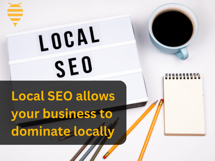 This graphic features a paper page with Local SEO written on it, next to a notepad and a cup of black coffee. There is overlay text highlighting that Local SEO allows your business to dominate local search results. In the top left is the swarm digital marketing logo.